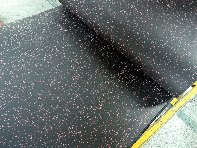 A detailed shot of a contractor checking the levelness of a concrete subfloor